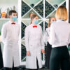 Employees of a Restaurant or Hotel in protective masks. End Of Q